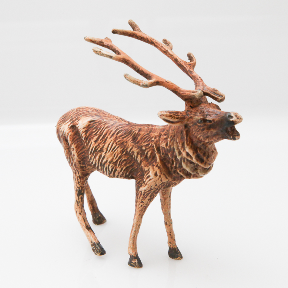 Cold painted bronze of a model of a stag, 11 cm long