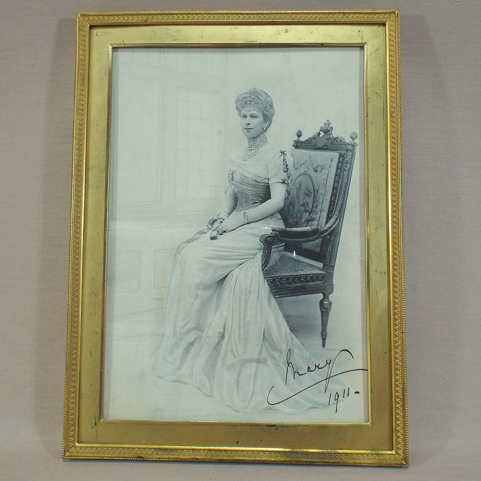 Signed photograph of Queen Mary dated 1911 in a rectangular gilt brass frame with green velvet
