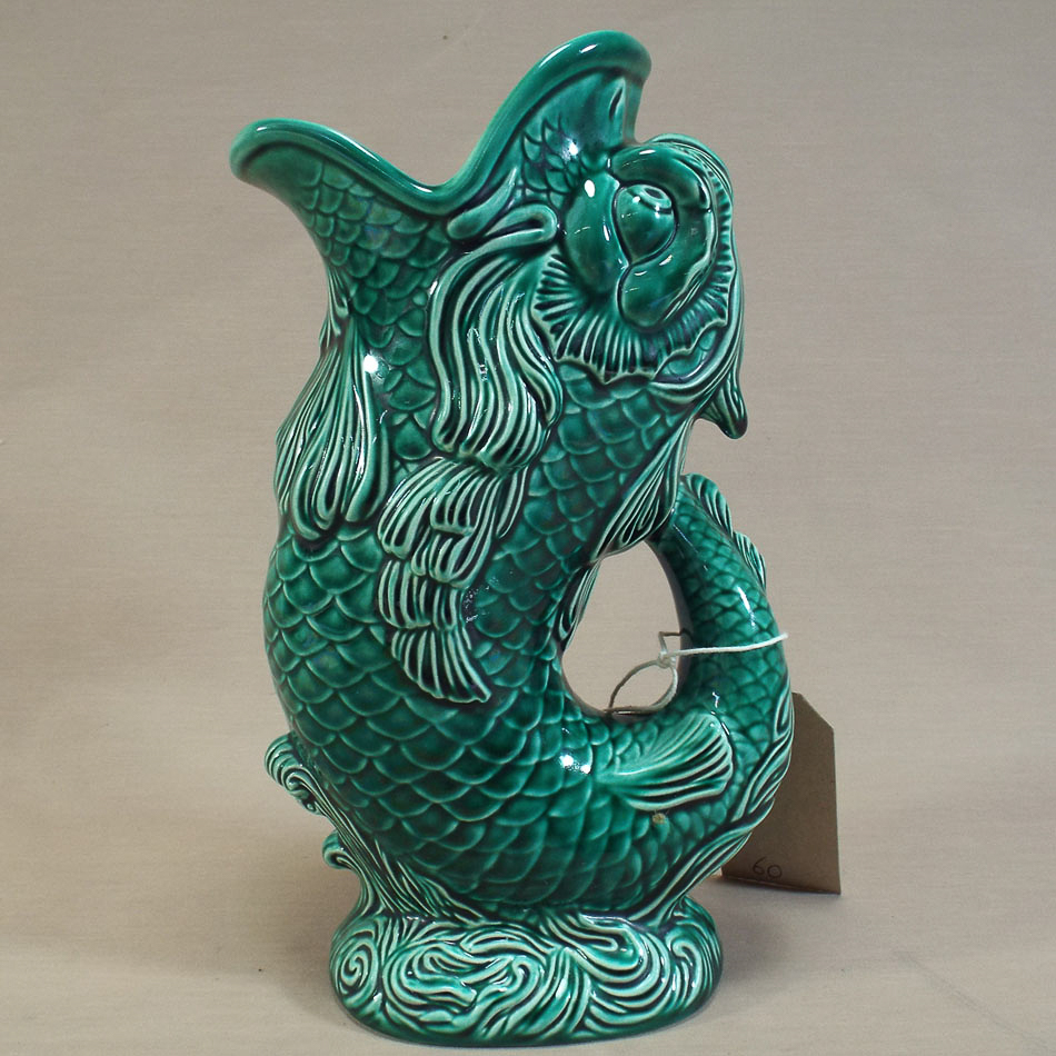 Wedgwood majolica dolphin jug in green glaze, approx 23 cm tall      Good