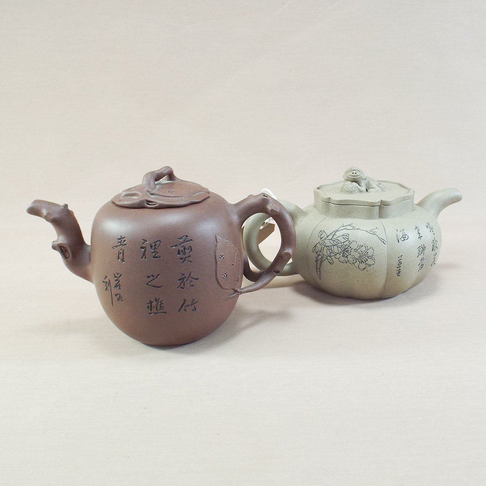 2 Yixing Chinese clay tea pots, one with naturalistically modelled tree type handle compressed