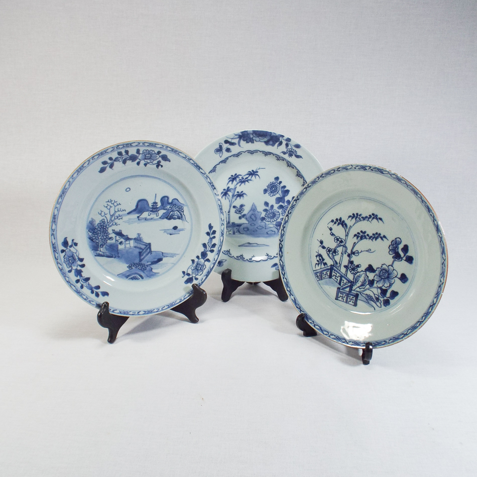 3 antique Chinese porcelain plates each decorated in blue and white with flowers, leaves and