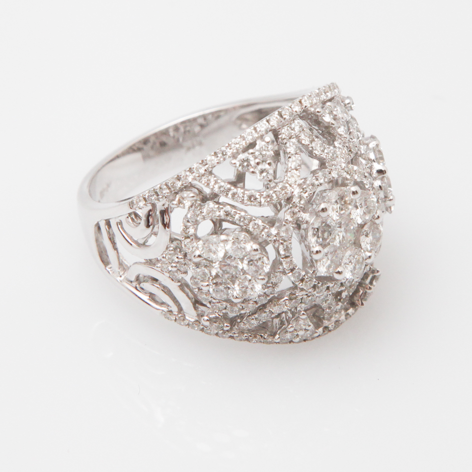 18 carat white gold modern diamond dress ring set with brilliant cut diamond clusters in an open