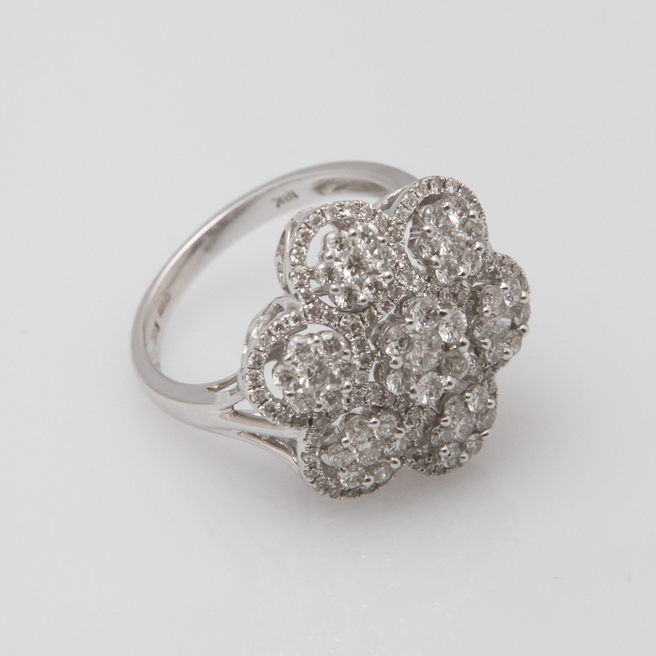 18 carat white gold ladies diamond cocktail ring set with 7 diamond clusters in an open work