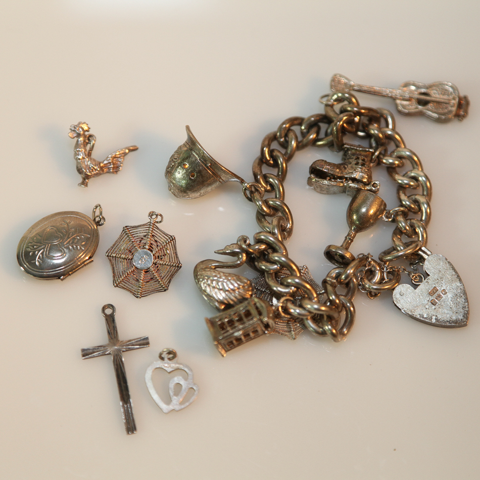 Chunky silver charm bracelet and 5 pendants