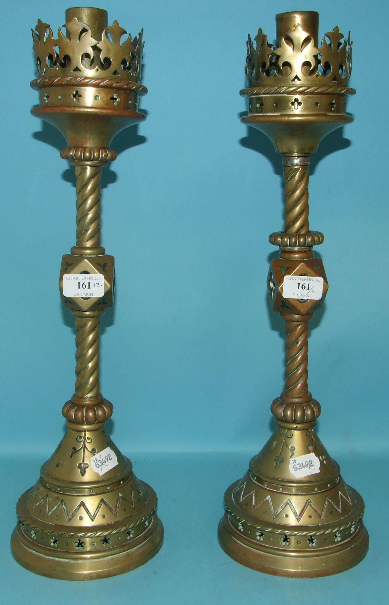 A pair of Pugin style Gothic revival brass candlesticks, 50.5 cm high (2)   Condition report  Report
