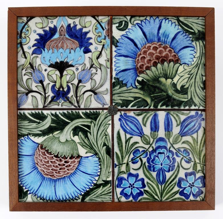 Two William de Morgan Persian flower style tiles, and two other similar tiles, framed as one, each