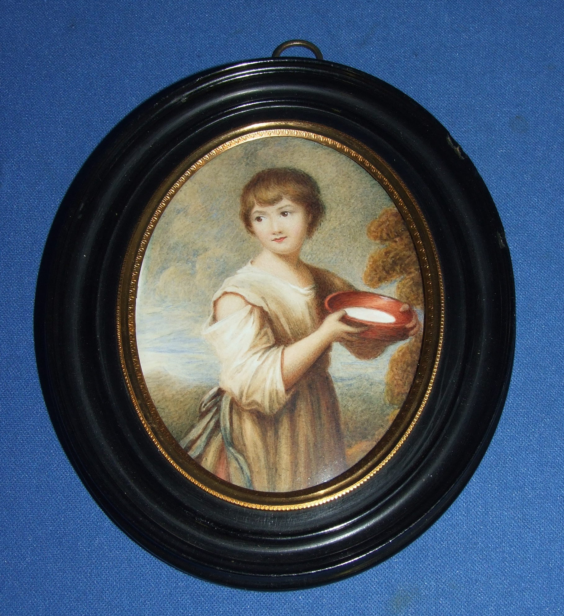 An oval three quarter length portrait, after Gainsborough, Lavinia Milk Maid, 11 x 8.5 cm