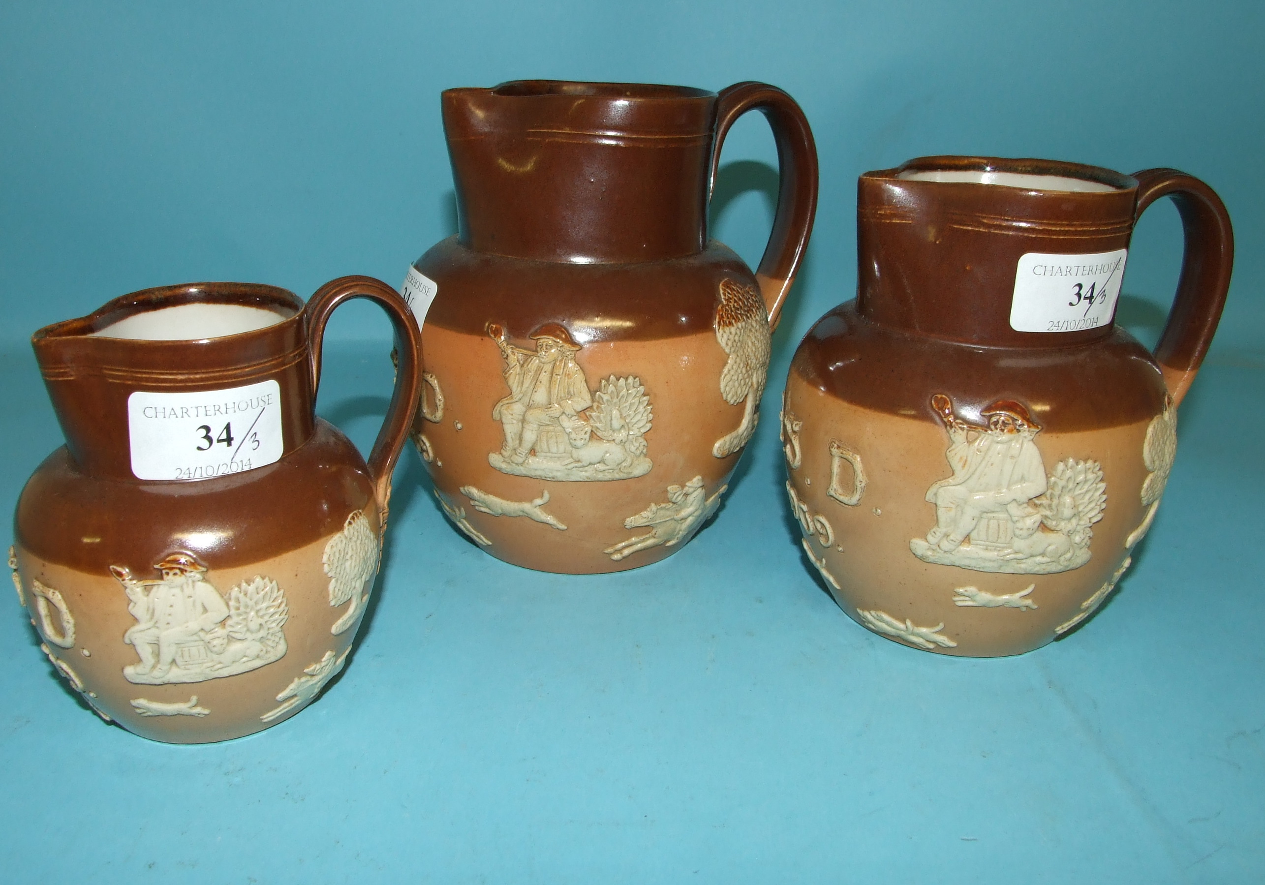 A set of three graduated Royal Doulton stoneware jugs, initialled and dated 1909, 8553, the - Image 3 of 3