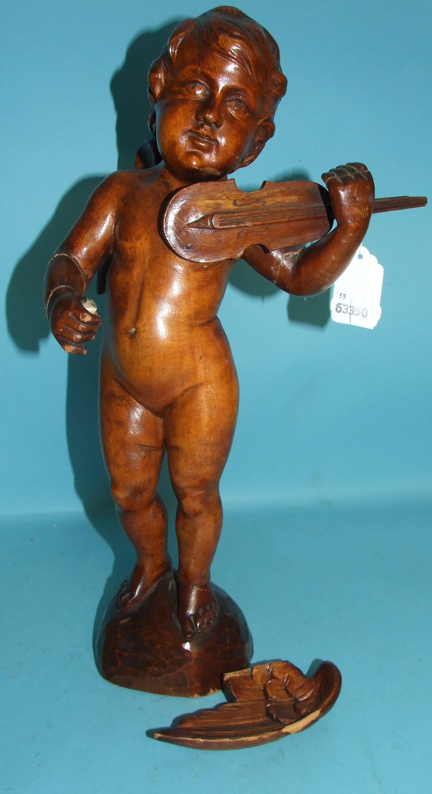 A carved wood figure, in the form of an angel playing a violin (a.f.), 42 cm high