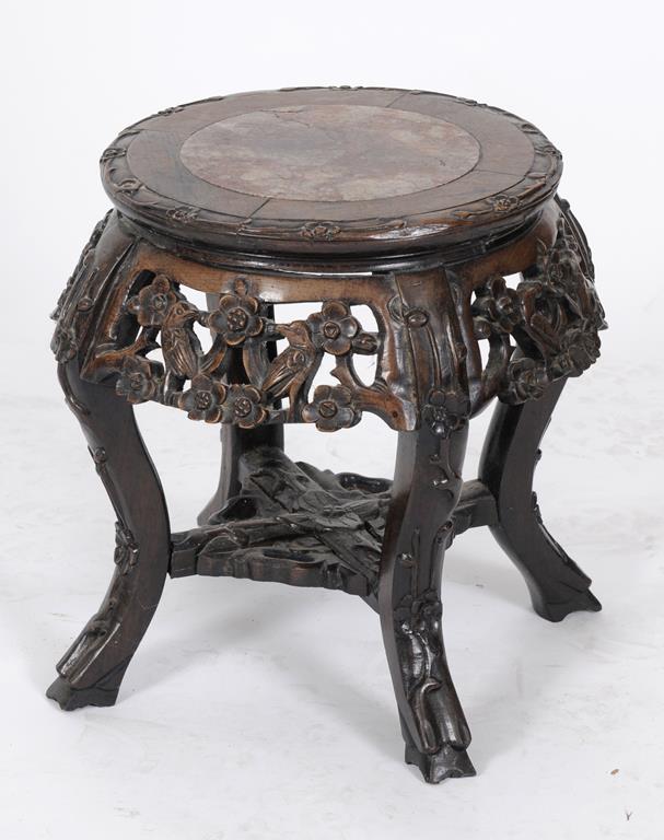 A Chinese pierced and carved hardwood jardiniere stand, with a marble inset top, 33.5 cm high  See