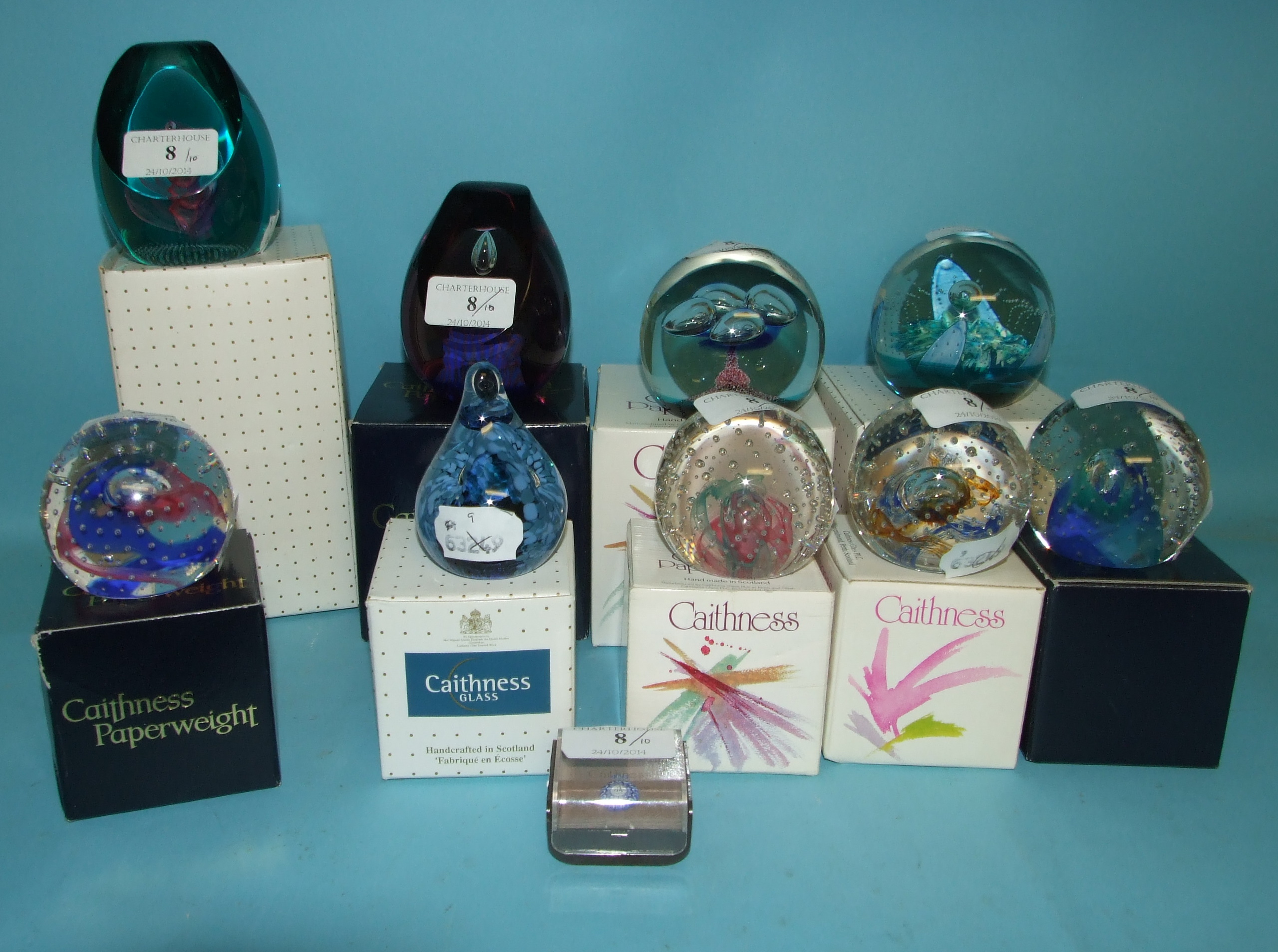 Nine Caithness glass collectors' paperweights, including Jack in the Box and Saladin, all boxed, and