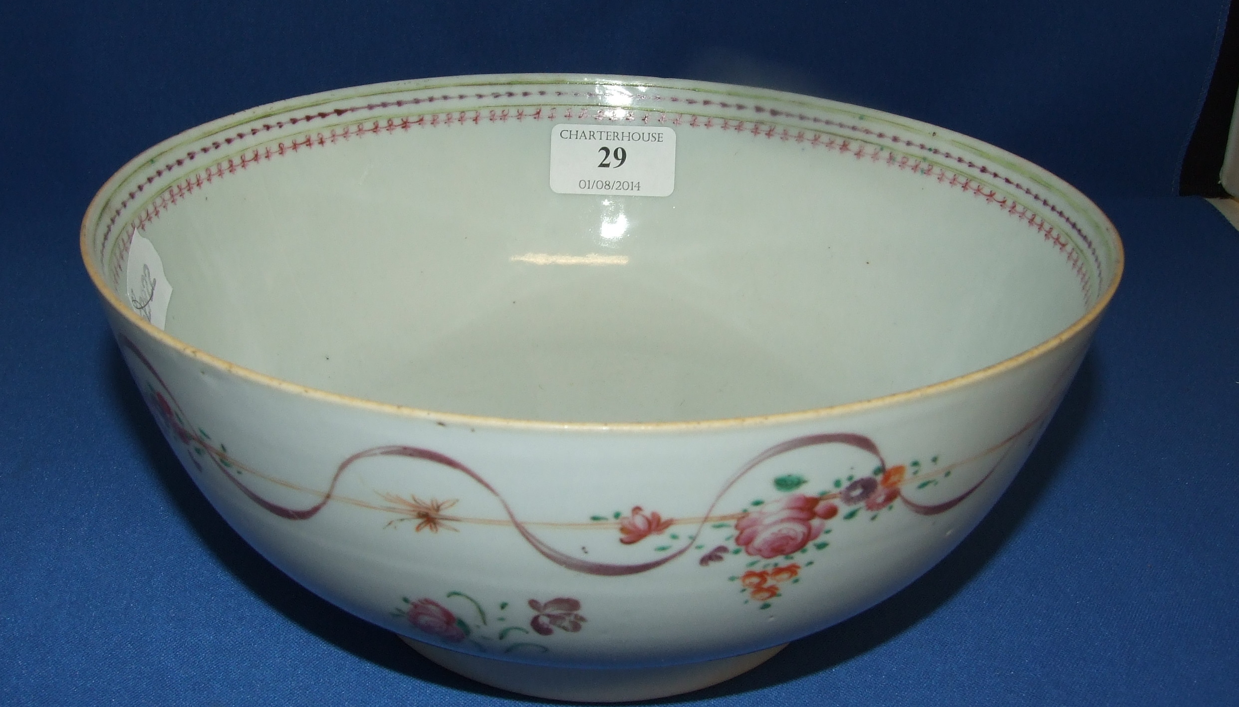 A Chinese export porcelain bowl, decorated flowers (a.f.), 23 cm diameter