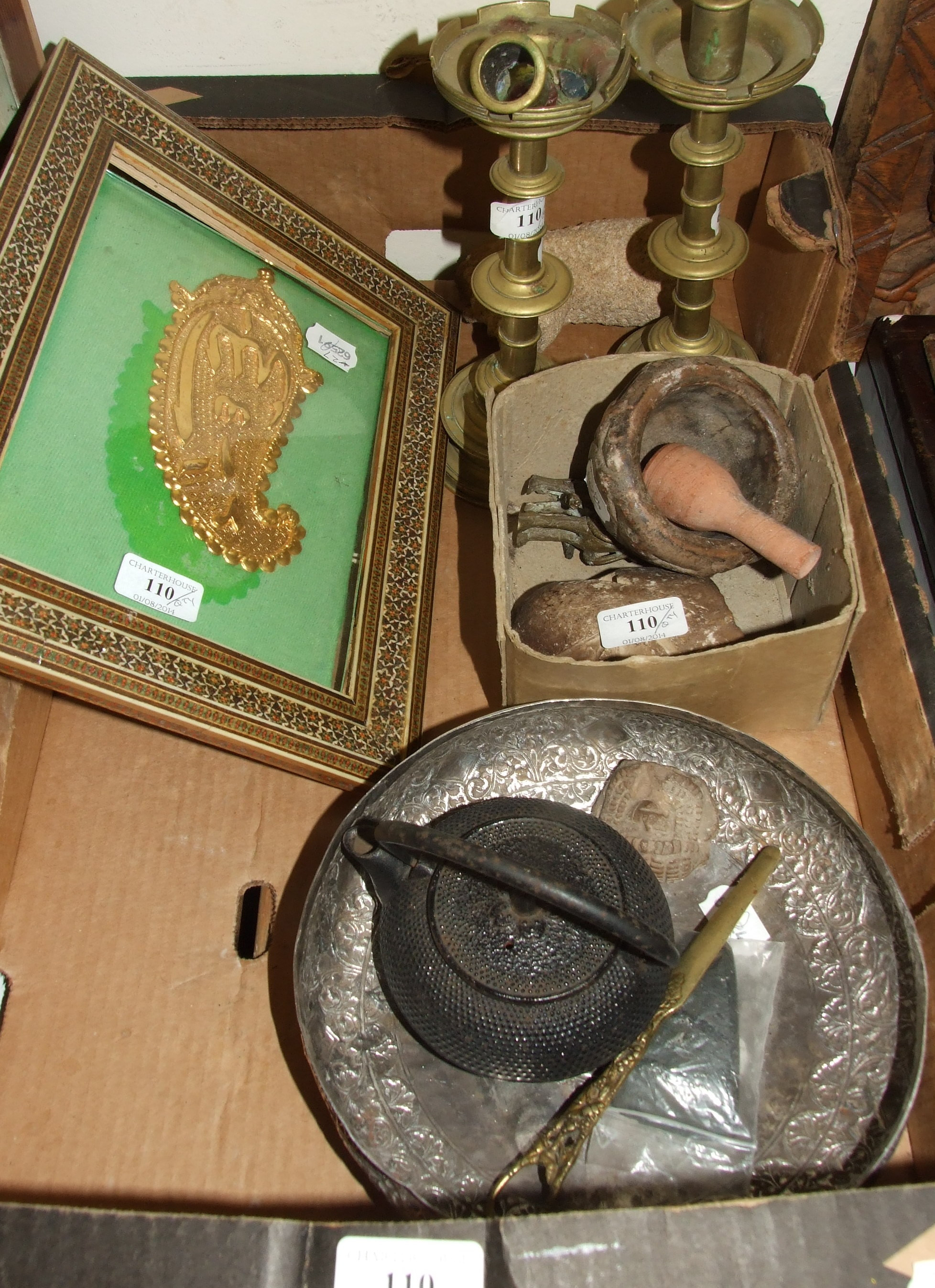 A silver coloured metal bowl, a pair of brass candlesticks, a gilt metal botek, in an inlaid