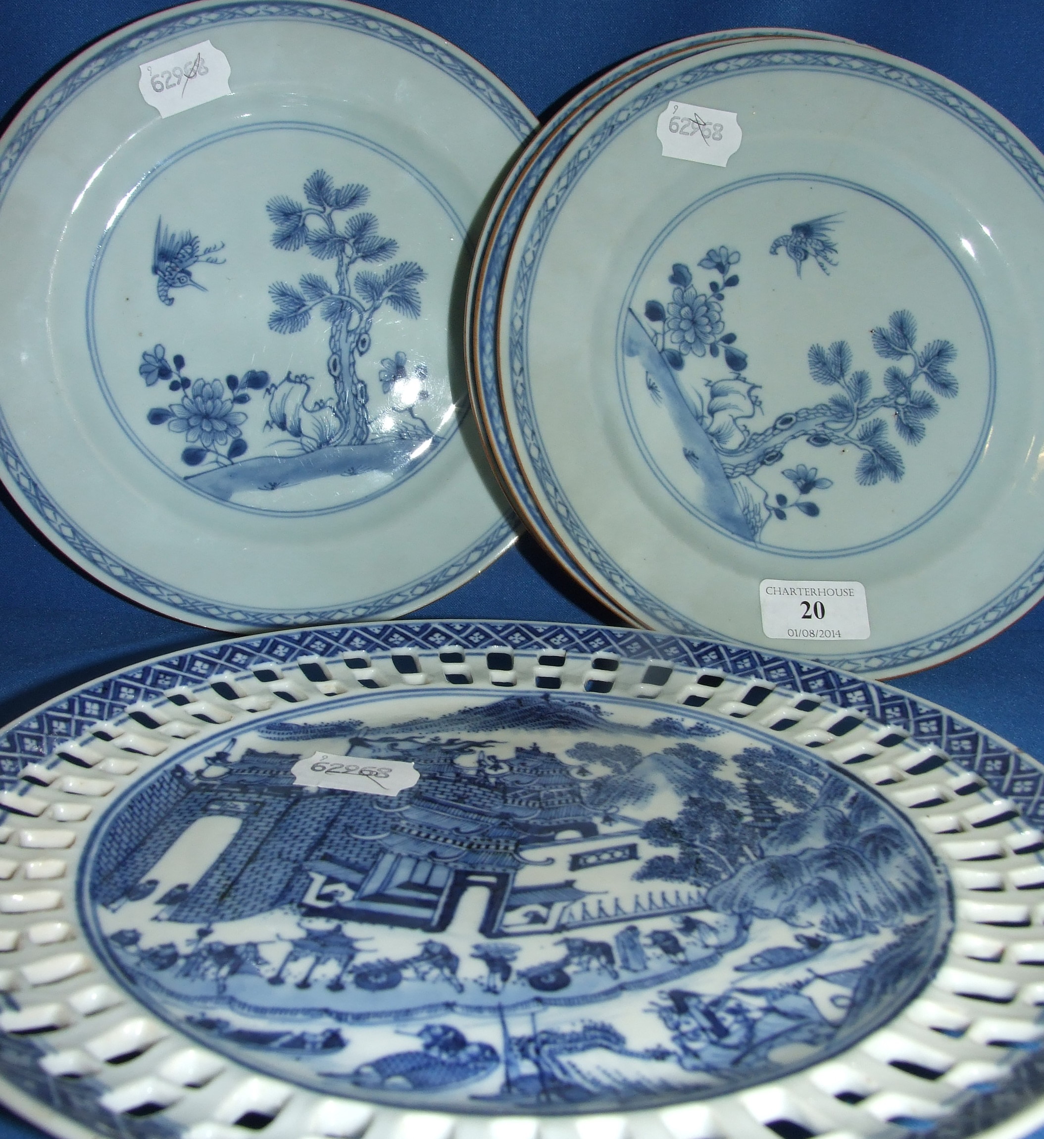 A set of four Chinese porcelain plates, with underglaze blue decoration, 23 cm diameter, and three