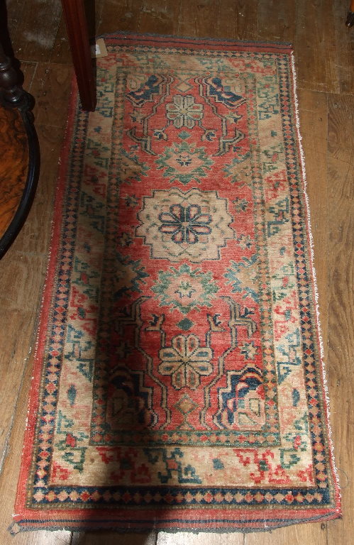 A Persian style runner, 324 x 85 cm, and a small mat (2)