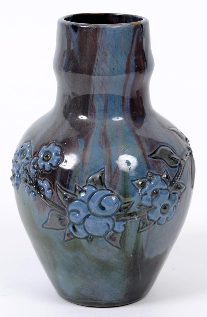 An Elton ware vase, decorated flowers and foliage, 17.5 cm high (chips)  See illustration