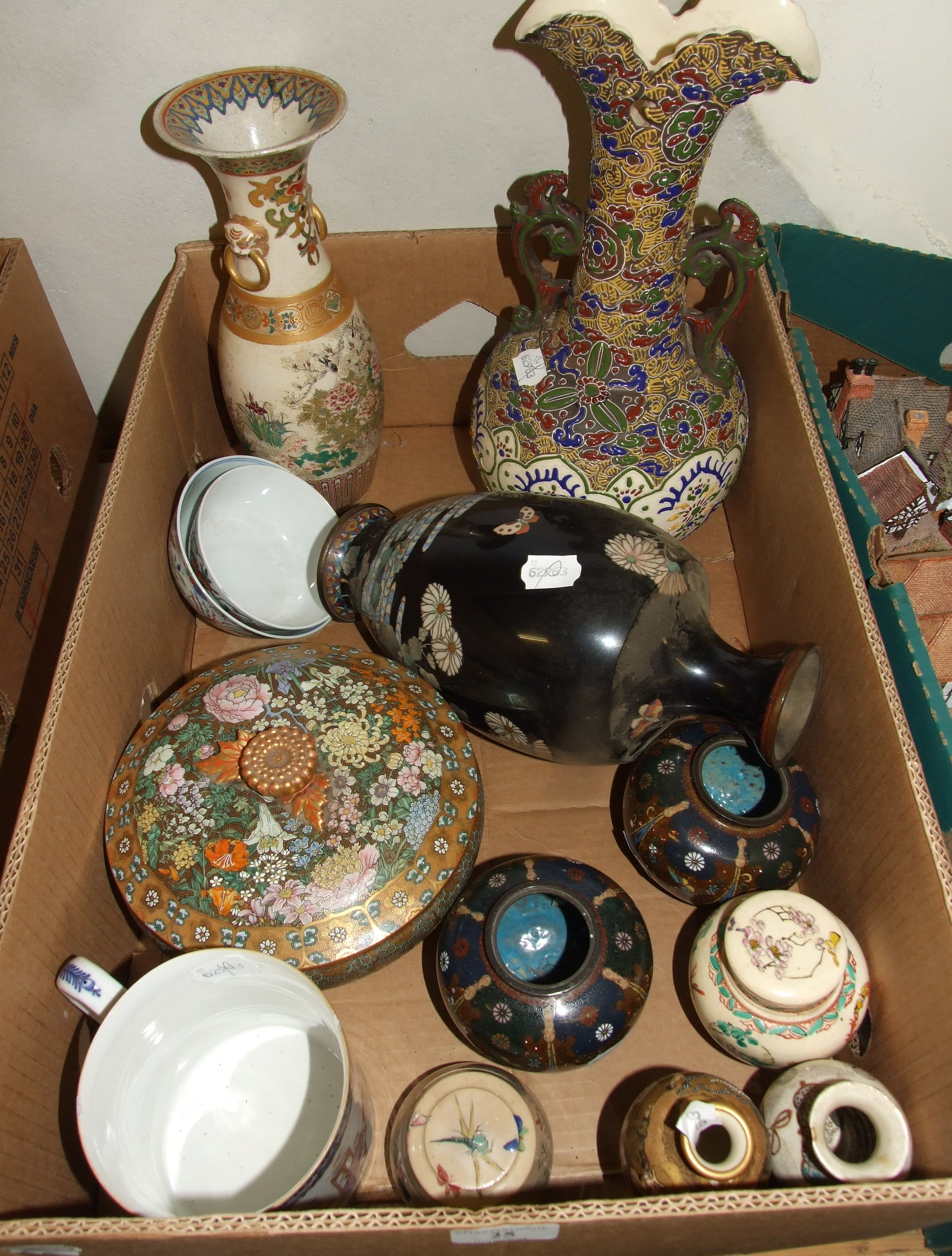 A Chinese porcelain mug, decorated figures, a cloisonné vase, two similar jars, and other