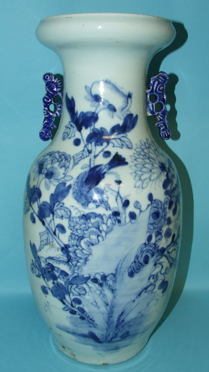 A Chinese porcelain vase, decorated a bird amongst flowers and foliage, in underglaze blue, 44 cm