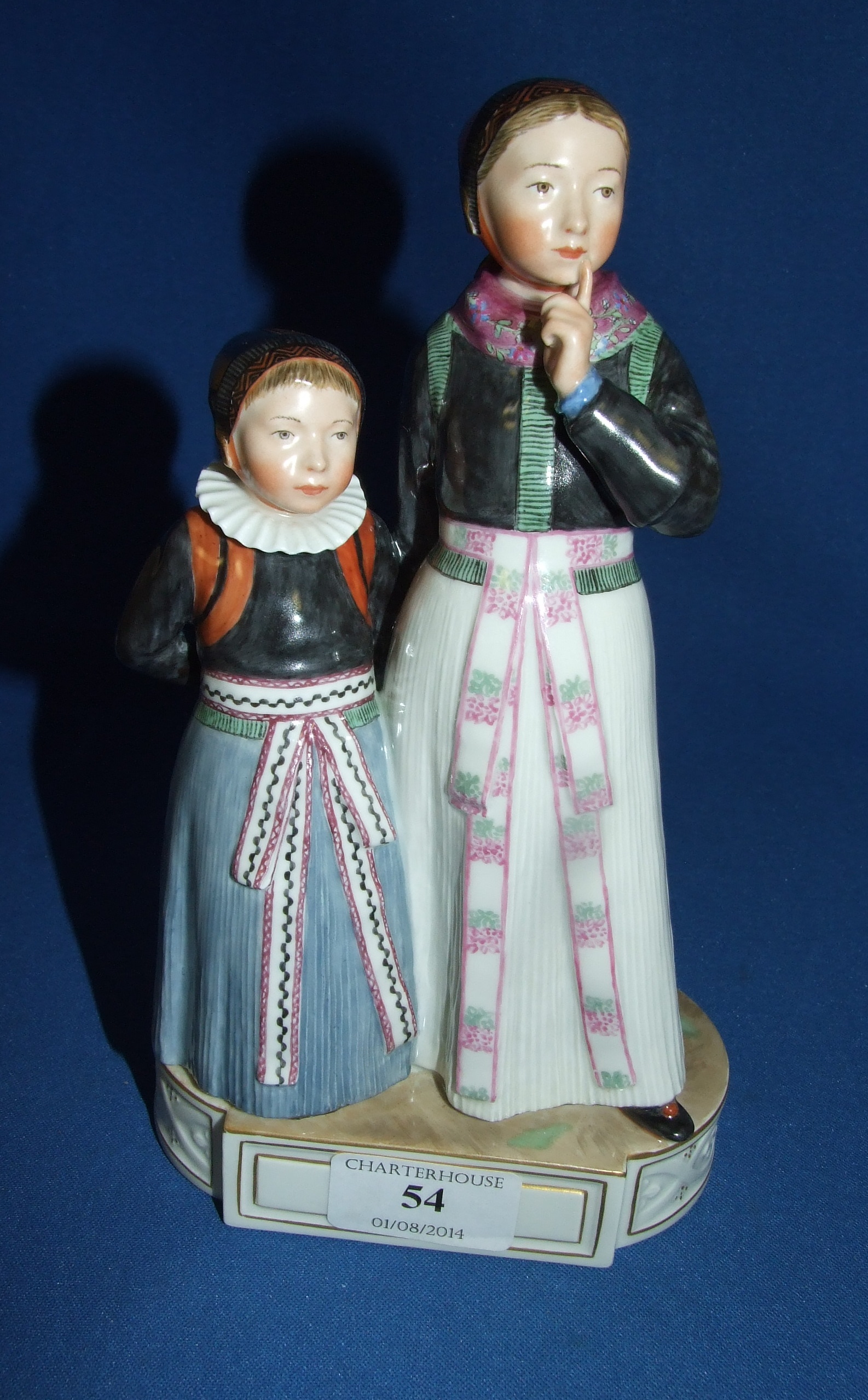 A Royal Copenhagen group, by Carl Martin Hansen, Amager Girls, 12105, 22 cm high   Condition report