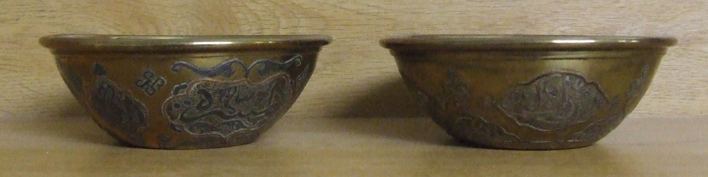 A pair of eastern brass bowls, with inlaid decoration, 12.5 cm diameter (2)
