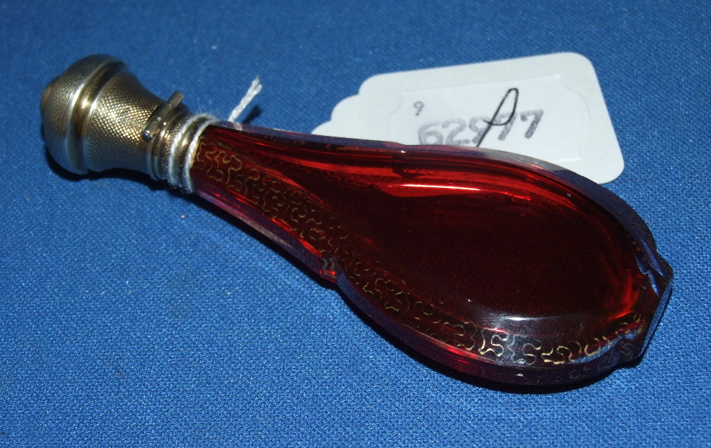 EXTRA LOT: A French silver coloured metal and cranberry glass scent bottle, the bottle of shaped