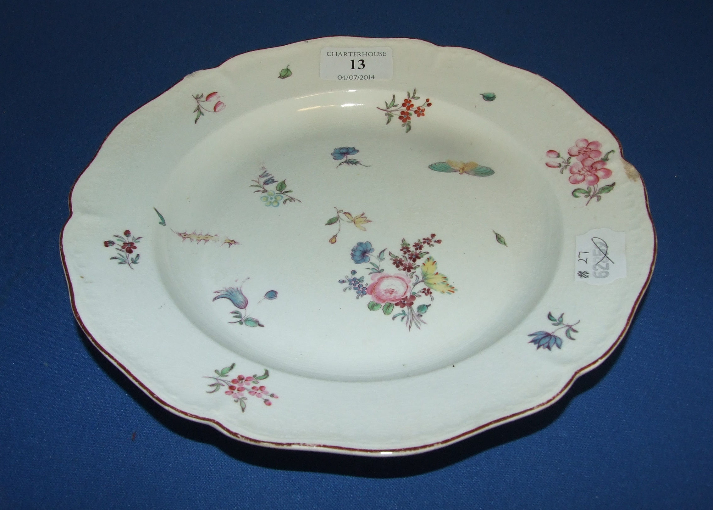 A Chelsea porcelain plate, painted flowers and insects, 14 cm diameter (a.f.)   Condition report