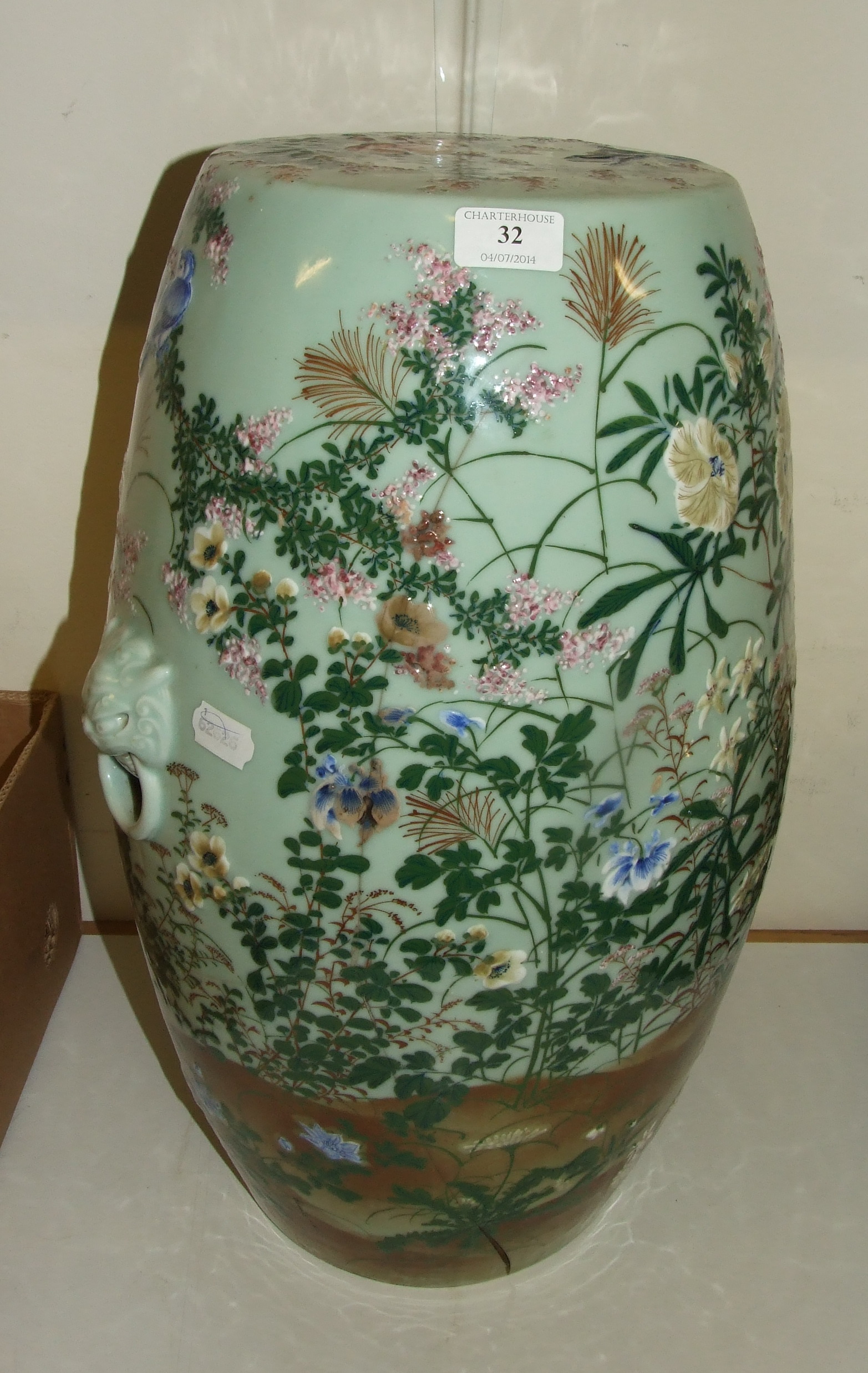 A Japanese pottery garden seat, decorated birds amongst flowers and foliage (a.f.), 54 cm high