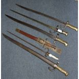 A French bayonet, 1873, with a scabbard, three similar bayonets, another bayonet, and a bayonet,