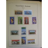 Assorted mint Channel Island stamps, other world stamps, in six albums, and one other album (7)