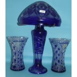 A blue and clear cut glass mushroom table lamp, 55 cm high, and a similar pair of vases, 27.5 cm (3)