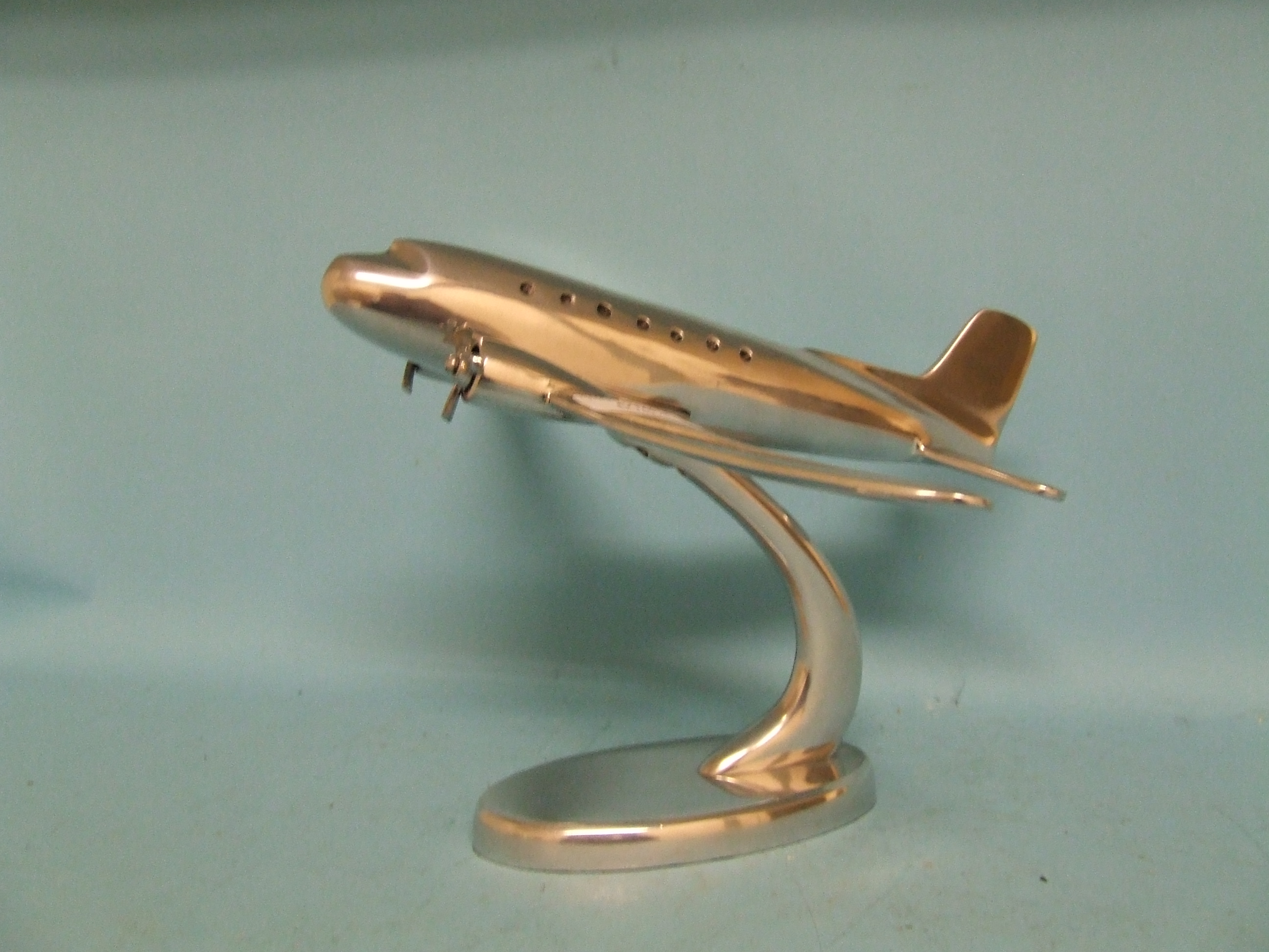 A model of Concorde, on a stand, 58 cm wide, and another similar (2)