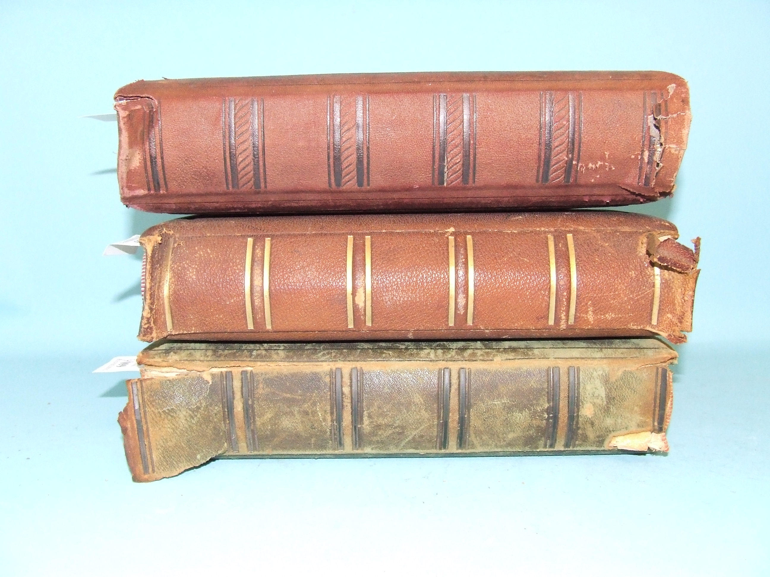 A Victorian tooled leather photograph album, and two others similar (a.f.) (3)