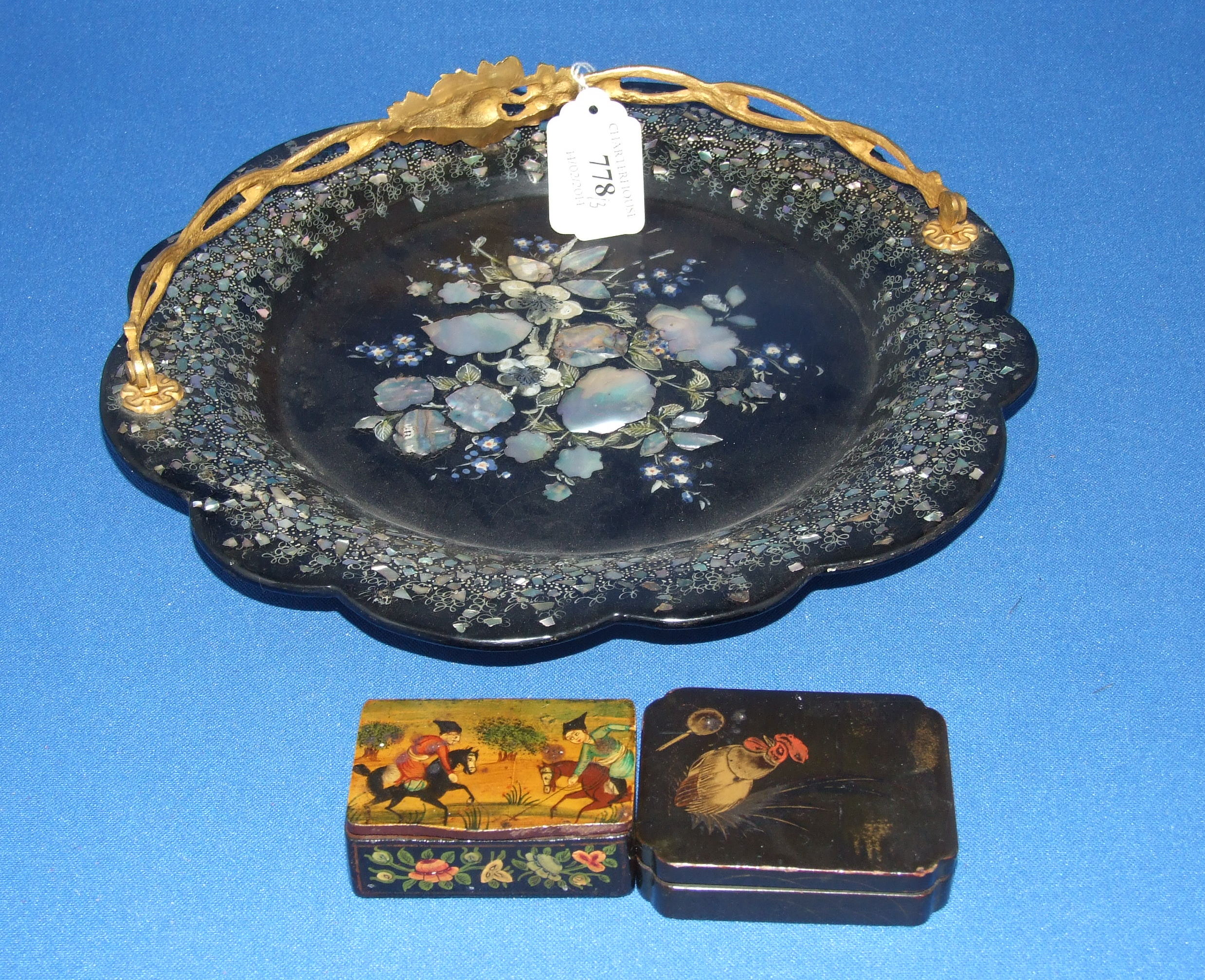 A lacquer dish, with mother of pearl inlay, 26 cm diameter, and two snuff boxes (3)