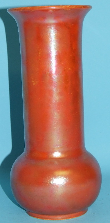 A Ruskin pottery orange lustre glaze vase, 24 cm high Condition report Report by NG

Some