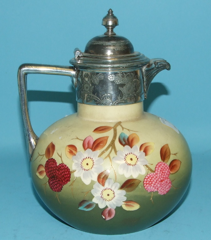 A late Victorian pottery jug, with plated mounts, 20 cm high