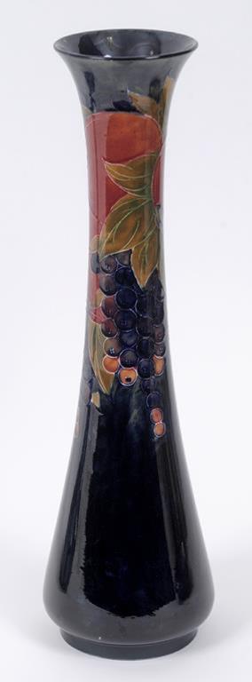 A large Moorcroft pottery Pomegranate pattern vase, the base impressed Moorcroft Burslem England 87,