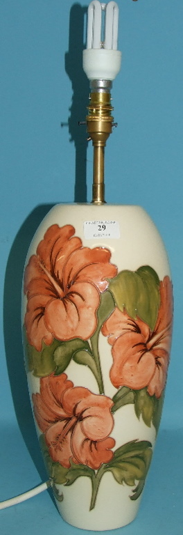 A large Moorcroft pottery Coral Hibiscus pattern table lamp, on a white ground, 36.5 cm high (