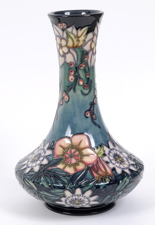 A Moorcroft pottery Carousel pattern vase, the base signed R J Bishop and numbered 644, with WM