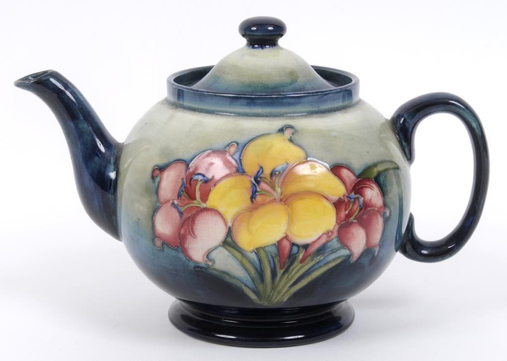 A Moorcroft pottery Freesia pattern teapot and cover, the base impressed W Moorcroft Potter To HM