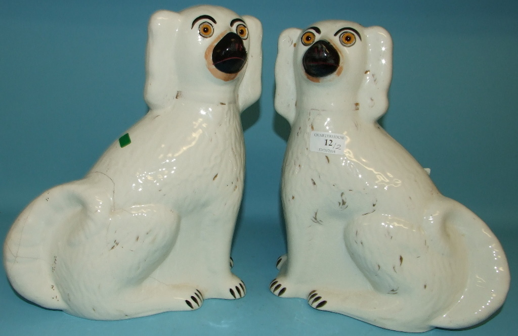 A pair of Staffordshire pottery dogs (a.f.), 30.5 cm high (2) Condition report Report by JB

Dog