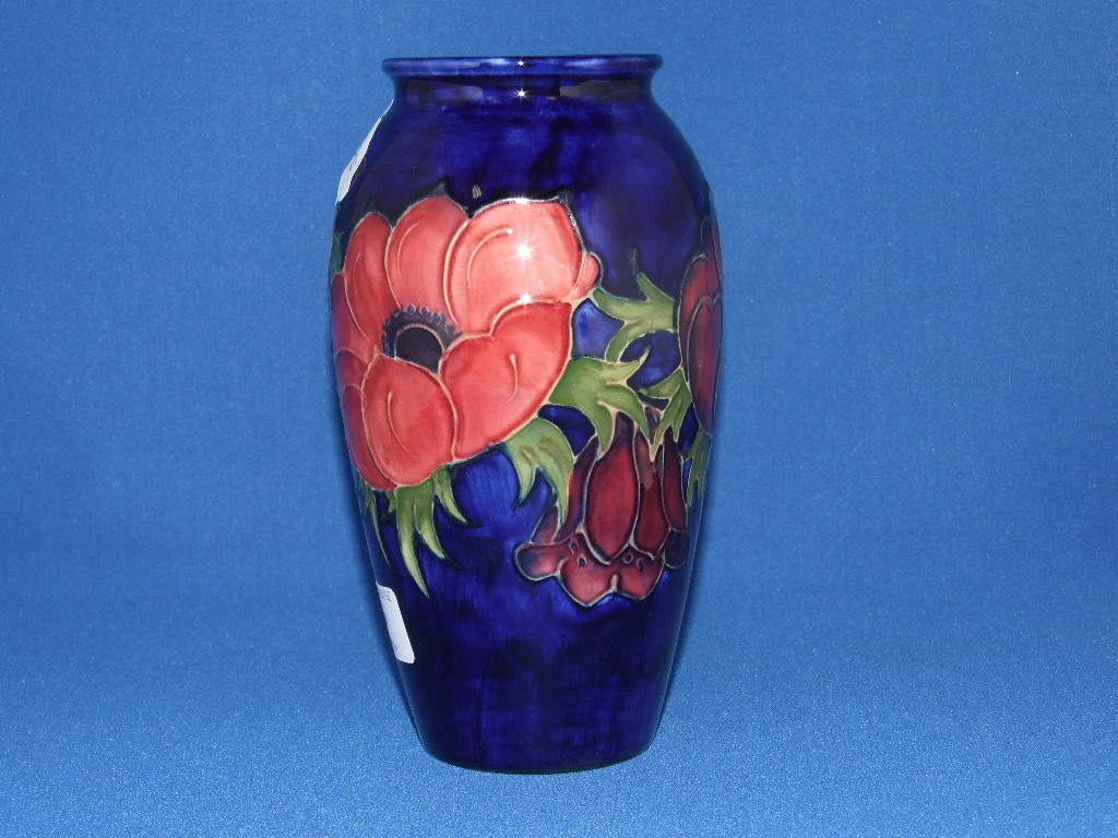 A Moorcroft pottery Anemone pattern vase, the base impressed Moorcroft Made In England, with green