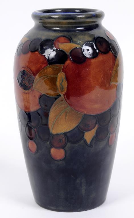 A Moorcroft pottery Pomegranate pattern vase, the base impressed Moorcroft Made In England, 2/5 (?),