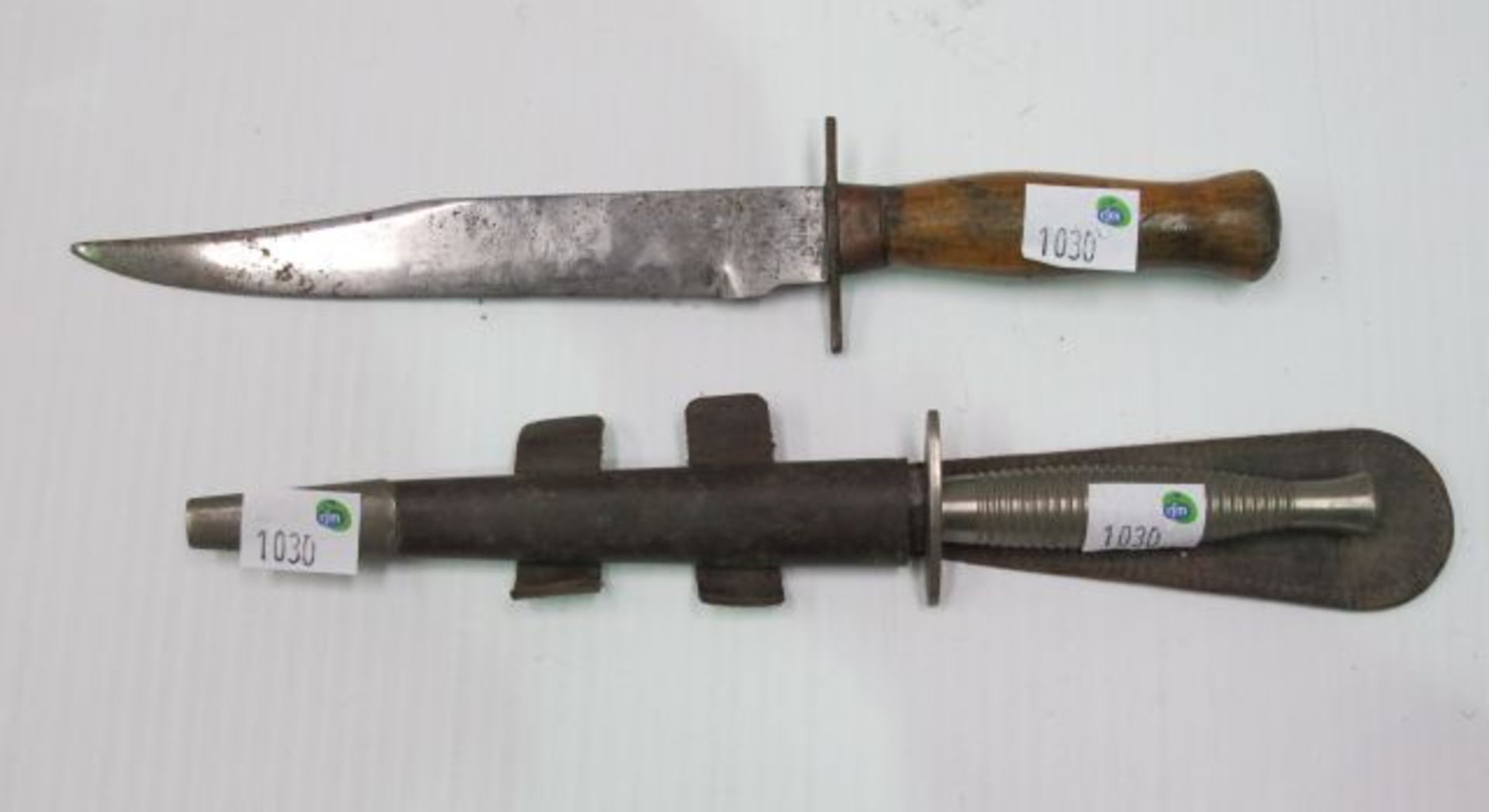 Two Dagger style Knives, one with Metal Tipped Scabbard. Length of blade and metal handle is 29.