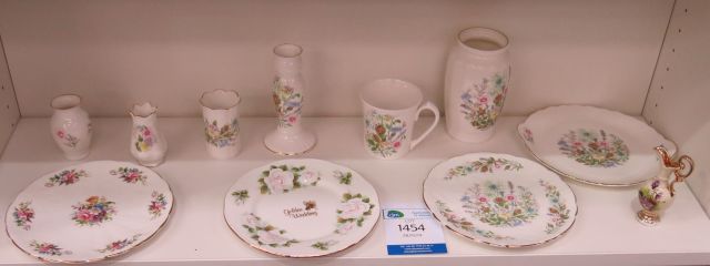 "Click here to bid.  Eight pieces of Aynsley `Wild Tudor` pattern ware - plates, vases etc