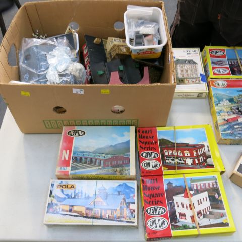 "Click here to bid.  A box of assorted `HO/OO` Gauge Model Railway Buildings and Building Kits (Note
