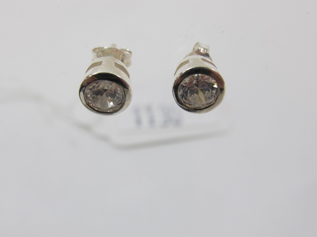 "Click here to bid.  A Pair of Sterling Silver Cubic Zirconia Stud Earrings (est. £25-£50)"