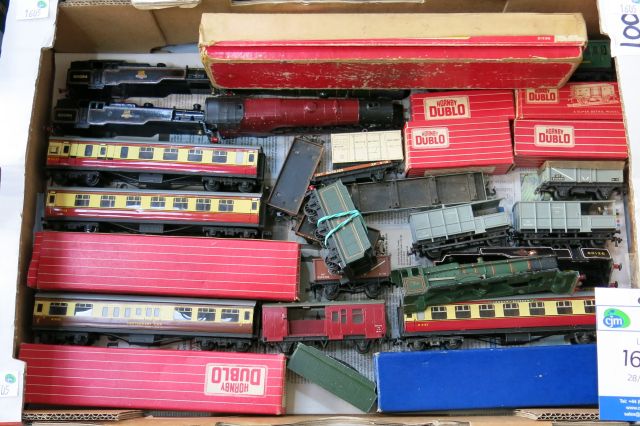 "Click here to bid.  A box of assorted Hornby Dublo Wagons, Coaches and Loco Bodyshells, some