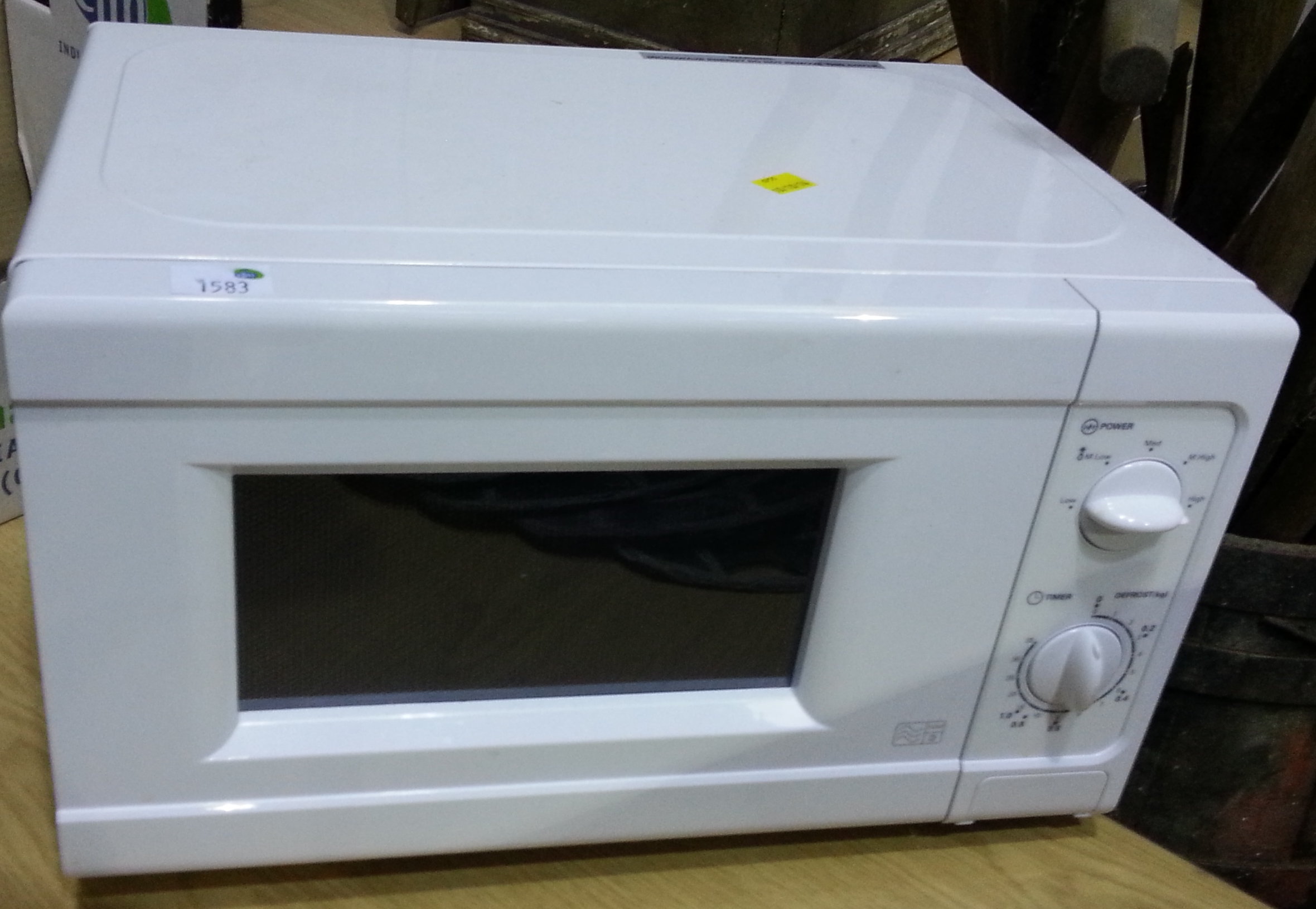 "Click here to bid.  Argos 700w Microwave Oven (est. £20-£30)"