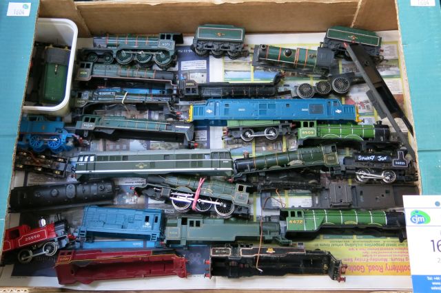 "Click here to bid.  A box of assorted `OO` gauge Loco`s and Loco Bodyshells (est. £20-£40)"