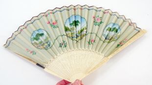 An ivory and painted folding fan, painted European scenes with pierced brise sticks (af)